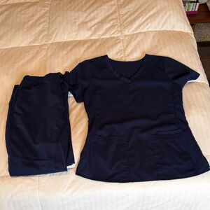 Scrubology set in navy blue, size XS. Used in good condition.